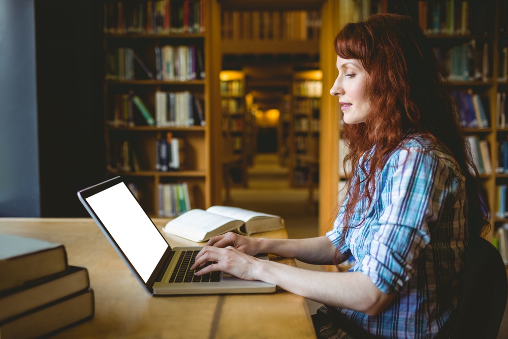 Mature student studying in library at the university