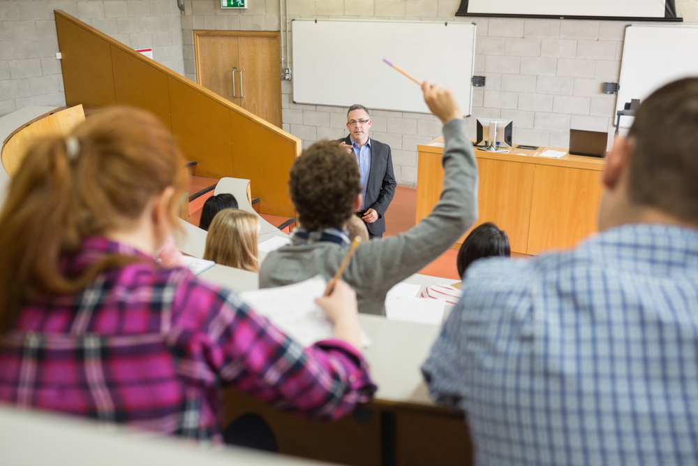 Students with a teacher at the college lecture hall